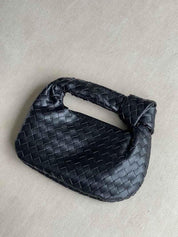 Women’s Woven Handbag With Knotted Handle And Curved Shape